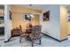 View of the dining room, with decorative chairs, art, and view to the kitchen at 578 Mcgill Ne Pl # 578, Atlanta, GA 30312