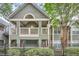 Charming condo with covered balcony, well-maintained landscaping and a black fence at 578 Mcgill Ne Pl # 578, Atlanta, GA 30312