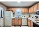 Bright kitchen featuring wood cabinets and white countertops at 578 Mcgill Ne Pl # 578, Atlanta, GA 30312