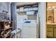 Laundry room featuring washer, dryer, storage shelving, and supplies at 578 Mcgill Ne Pl # 578, Atlanta, GA 30312