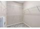 Large walk-in closet features built-in shelving and carpeted floor at 1370 Dupont Nw Park, Atlanta, GA 30318