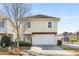 Charming two-story home with a pergola over the garage, a well manicured lawn, and neatly trimmed bushes at 1370 Dupont Nw Park, Atlanta, GA 30318
