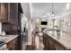 Open-concept kitchen with granite countertops, island, and stainless steel refrigerator at 1370 Dupont Nw Park, Atlanta, GA 30318