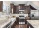 Charming kitchen boasts granite counters, stainless appliances, and a farmhouse sink at 1370 Dupont Nw Park, Atlanta, GA 30318