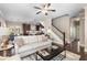 Open-concept living room with hardwood floors and staircase access at 1370 Dupont Nw Park, Atlanta, GA 30318