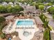 A luxurious outdoor pool and jacuzzi is surrounded by lounge chairs and covered cabanas at 1370 Dupont Nw Park, Atlanta, GA 30318