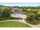 A view of the community pool area with pool, jacuzzi, lounge chairs, and lush landscaping at 1370 Dupont Nw Park, Atlanta, GA 30318