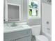 Bathroom features a modern vanity, mirror, and a shower-tub combination at 3439 Twin Village Ct, Snellville, GA 30039
