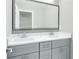 Bathroom vanity features double sinks, white marble counters, and gray cabinets at 3439 Twin Village Ct, Snellville, GA 30039