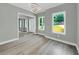Open-concept living area with gray walls, light trim, and wood-look flooring at 3439 Twin Village Ct, Snellville, GA 30039