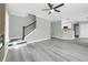 Open living area features sleek floors, staircase, and seamless flow to the kitchen at 3439 Twin Village Ct, Snellville, GA 30039
