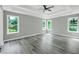 Spacious main bedroom has hardwood floors, tray ceiling, and lots of natural light at 3439 Twin Village Ct, Snellville, GA 30039