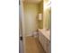 Bathroom with tile flooring, sink, toilet, and white cabinets at 5252 Inverness Ct, Douglasville, GA 30135