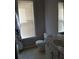 Bathroom with a bathtub, shower curtain and single sink vanity at 5252 Inverness Ct, Douglasville, GA 30135
