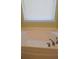 Close-up of a modern bathtub featuring chrome fixtures and a window with blinds at 5252 Inverness Ct, Douglasville, GA 30135
