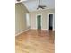 Spacious main bedroom featuring a ceiling fan, hardwood floors, and ample natural light at 5252 Inverness Ct, Douglasville, GA 30135