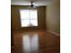 Bedroom featuring hardwood flooring, a ceiling fan, and a window with blinds at 5252 Inverness Ct, Douglasville, GA 30135