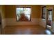 A cozy dining room with a large window letting in lots of natural light, wainscoting, and bamboo shades at 5252 Inverness Ct, Douglasville, GA 30135