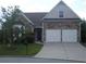 Charming single-Gathering home with stone accents, well-maintained lawn and two-car garage at 5252 Inverness Ct, Douglasville, GA 30135