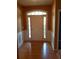 Inviting home foyer with hardwood flooring, decorative molding, and natural light at 5252 Inverness Ct, Douglasville, GA 30135
