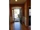 Open foyer features hardwood floors, natural light, and an open front door at 5252 Inverness Ct, Douglasville, GA 30135