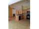 Modern kitchen with wooden cabinets, black appliances, tile backsplash, and open layout at 5252 Inverness Ct, Douglasville, GA 30135