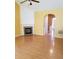 Open living room with hardwood floors, fireplace, and ceiling fan at 5252 Inverness Ct, Douglasville, GA 30135
