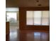Open concept living area with hardwood floors, natural light, and adjacent dining area at 5252 Inverness Ct, Douglasville, GA 30135