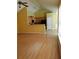 Open-concept living area with hardwood floors, kitchen with bar, and high ceilings at 5252 Inverness Ct, Douglasville, GA 30135