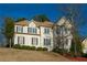 Elegant two-story home showcasing symmetrical windows and a well-maintained lawn, offering timeless appeal at 600 Oakmont Hl, Duluth, GA 30097
