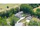 Stunning aerial view of estate home, guest house, horse barn, pool, and well landscaped grounds at 604 Trinity Church Rd, Canton, GA 30115