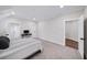 Spacious bedroom with soft carpet, featuring access to other rooms at 604 Trinity Church Rd, Canton, GA 30115