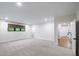 This bonus room is big, empty, and features a large window at 604 Trinity Church Rd, Canton, GA 30115