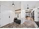 Inviting entryway with tiled floors, coat rack, and seamless transition to living area at 604 Trinity Church Rd, Canton, GA 30115