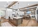 Open-concept kitchen with island, dining area, and cozy living space create a perfect gathering spot at 604 Trinity Church Rd, Canton, GA 30115