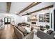 Open-concept living room with wood beams, fireplace, and built-in shelving at 604 Trinity Church Rd, Canton, GA 30115