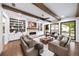 Bright living room featuring a painted brick fireplace and large windows at 604 Trinity Church Rd, Canton, GA 30115