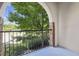 Balcony view of mature tree and landscaping, with brick and stucco construction at 901 Abernathy Rd # 2200, Sandy Springs, GA 30328