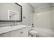 Bathroom features vanity with marble countertop, white subway tile, and shower-tub combo at 901 Abernathy Rd # 2200, Sandy Springs, GA 30328