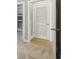 Hallway with access to closet and storage, showcasing wood floor and carpet at 901 Abernathy Rd # 2200, Sandy Springs, GA 30328