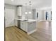 Open-concept kitchen with a large island and modern appliances, ideal for entertaining at 901 Abernathy Rd # 2200, Sandy Springs, GA 30328