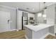 Contemporary kitchen featuring stainless steel appliances and a large island with seating at 901 Abernathy Rd # 2200, Sandy Springs, GA 30328
