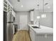 Modern kitchen featuring stainless steel appliances and a sleek quartz countertop at 901 Abernathy Rd # 2200, Sandy Springs, GA 30328