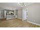 Open-concept layout with hardwood floors connecting the living area to a modern kitchen at 901 Abernathy Rd # 2200, Sandy Springs, GA 30328
