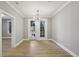 Cozy living area with hardwood floors, neutral paint, and balcony access for natural light at 901 Abernathy Rd # 2200, Sandy Springs, GA 30328
