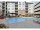 Apartment complex featuring an outdoor pool with plenty of lounge seating at 901 Abernathy Rd # 2200, Sandy Springs, GA 30328