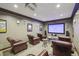 Theater room includes comfortable seating, projector, and large screen at 901 Abernathy Rd # 2200, Sandy Springs, GA 30328