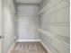 Organized walk-in closet with shelving, providing ample storage space at 901 Abernathy Rd # 2200, Sandy Springs, GA 30328