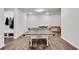 The basement game room has a ping pong table, a foosball table, exercise equipment, and hardwood flooring at 1823 Lynwood Ln, Atlanta, GA 30329