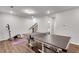 The basement game room has a ping pong table, a foosball table, exercise equipment, and hardwood flooring at 1823 Lynwood Ln, Atlanta, GA 30329